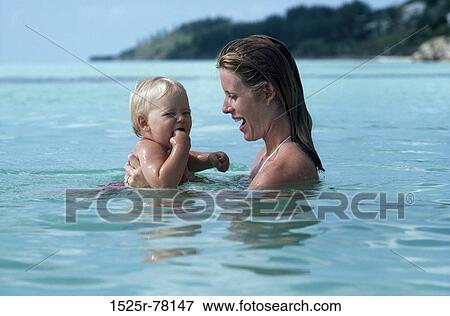 Stock Photo - people, mother, baby, outdoors, family, parent. Fotosearch