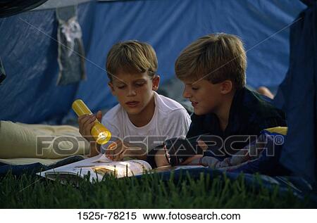 Stock Photography - people, night, reading, shining, book, outdoors. Fotosearch