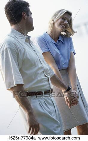 Stock Image - people, smiling, couple, outdoors, Middle-aged, smile, affection. Fotosearch