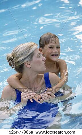 Stock Image - people, water, pool, smiling, mother, outdoors, hugging. Fotosearch