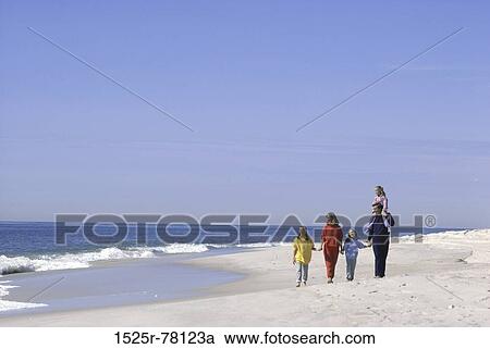 people, water, walking, beach, carrying, family, shoulder View Large Photo Image Stock Image - people, water, walking, beach, carrying, family, shoulder. Fotosearch