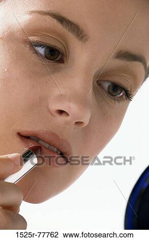people, woman, concentration, concentrating, lips, makeup, lipstick View Large Photo Image Stock Image - people, woman, concentration, concentrating, lips, makeup, lipstick. Fotosearch