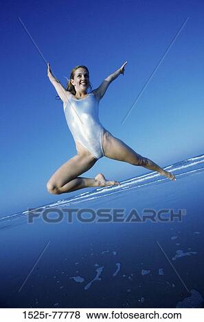 people, woman, jump, smiling, jumping, happy, outdoors View Large Photo Image Stock Photo - people, woman, jump, smiling, jumping, happy, outdoors. Fotosearch
