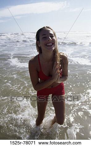 people, woman, smiling, beach, laughing, cold, bright View Large Photo Image Stock Image - people, woman, smiling, beach, laughing, cold, bright. Fotosearch