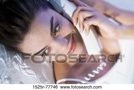 people, woman, telephone, talking, Hispanic, phone, laying View Large Photo Image Stock Photograph - people, woman, telephone, talking, Hispanic, phone, laying. Fotosearch