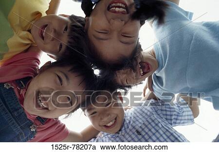 Portrait of a group of children in a huddle View Large Photo Image Stock Image - Portrait of a group of children in a huddle. Fotosearch