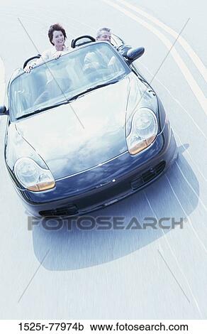 Portrait of a mid adult couple in a convertible car View Large Photo Image Stock Image - Portrait of a mid adult couple in a convertible car. Fotosearch