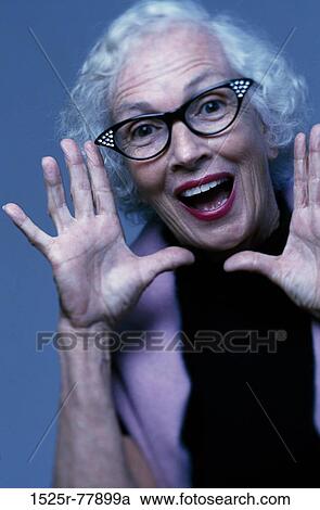 Portrait of a senior woman looking shocked View Large Photo Image Stock Image - Portrait of a senior woman looking shocked. Fotosearch