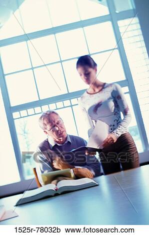 Teacher checking a student's notebook View Large Photo Image Stock Image - Teacher checking a student's notebook. Fotosearch