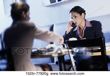 Two businesswomen in a cafe View Large Photo Image Stock Image - Two businesswomen in a cafe. Fotosearch