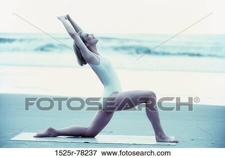 woman, beach, stretching, health, sports, Middle-aged View Large Photo Image Stock Photo - woman, beach, stretching, health, sports, Middle-aged. Fotosearch