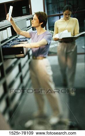women, blur, walking, busy, reading, folder, standing View Large Photo Image Stock Photo - women, blur, walking, busy, reading, folder, standing. Fotosearch
