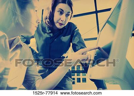 women, people, coworkers, computer, pointing, business, point View Large Photo Image Picture - women, people, coworkers, computer, pointing, business, point. Fotosearch