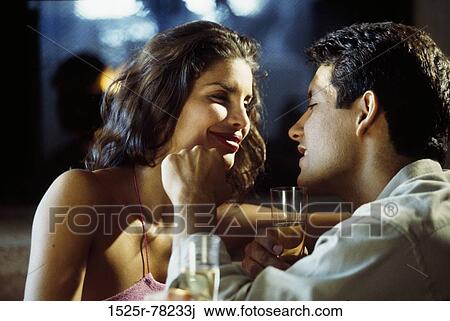 Young couple drinking champagne View Large Photo Image Stock Image - Young couple drinking champagne. Fotosearch