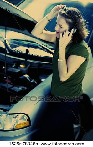 Young woman talking on a mobile phone View Large Photo Image Stock Image - Young woman talking on a mobile phone. Fotosearch