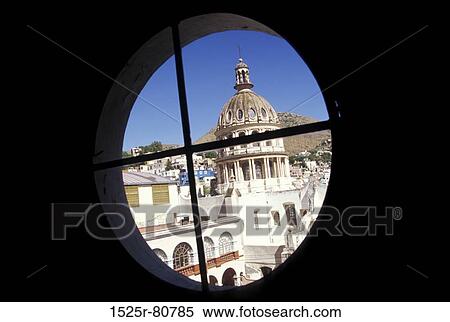 Stock Photography - Buildings in a city as viewed through a window. Fotosearch