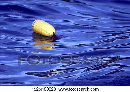 Buoy floating on water View Large Photo Image Stock Photo - Buoy floating on water. Fotosearch