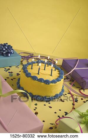 Close-up of a birthday cake and birthday presents on a table View Large Photo Image Stock Image - Close-up of a birthday cake and birthday presents on a table. Fotosearch