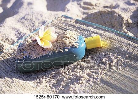 Close-up of a bottle with a flower on the mat on the beach View Large Photo Image Stock Image - Close-up of a bottle with a flower on the mat on the beach. Fotosearch