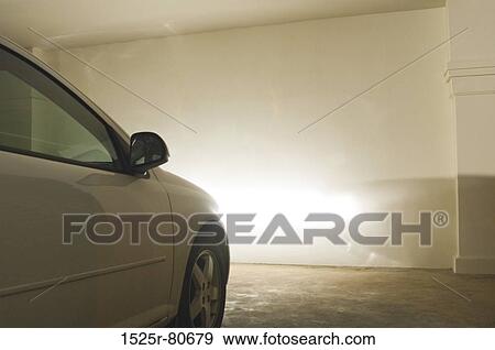 Close-up of a car parked in a parking lot View Large Photo Image Stock Photo - Close-up of a car parked in a parking lot. Fotosearch