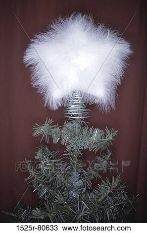 Stock Image - Close-up of a fur star on a Christmas tree. Fotosearch