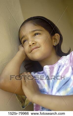 Close-up of a girl thinking View Large Photo Image Stock Photograph - Close-up of a girl thinking. Fotosearch