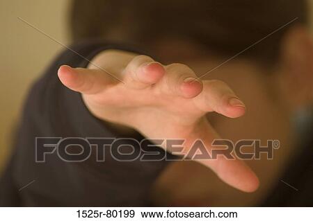 Stock Photo - Close-up of a person's hand. Fotosearch