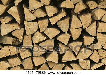Stock Photo - Close-up of a stack of wooden logs. Fotosearch