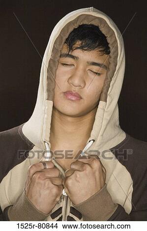 Close-up of a teenage boy with his eyes closed View Large Photo Image Picture - Close-up of a teenage boy with his eyes closed. Fotosearch