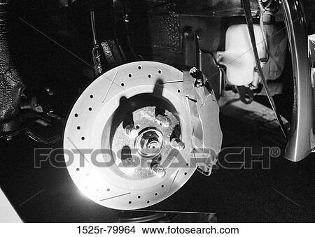Close-up of a wheel hub in auto repair shop View Large Photo Image Picture - Close-up of a wheel hub in auto repair shop. Fotosearch
