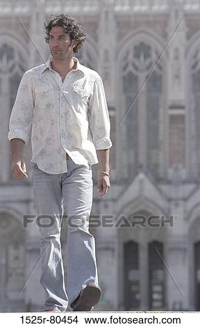 Close-up of a young man walking View Large Photo Image Picture - Close-up of a young man walking. Fotosearch