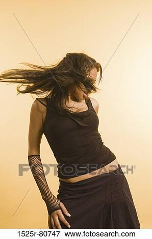 Close-up of a young woman posing View Large Photo Image Stock Photo - Close-up of a young woman posing. Fotosearch
