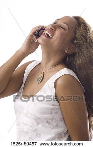 Close-up of a young woman using a mobile phone View Large Photo Image Stock Photo - Close-up of a young woman using a mobile phone. Fotosearch