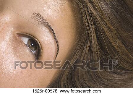 Close-up of a young woman's eye View Large Photo Image Stock Photo - Close-up of a young woman's eye. Fotosearch