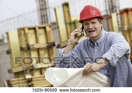 Close-up of an architect using a mobile phone View Large Photo Image Stock Photo - Close-up of an architect using a mobile phone. Fotosearch