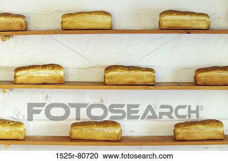 Close-up of brown breads in shelves View Large Photo Image Stock Image - Close-up of brown breads in shelves. Fotosearch