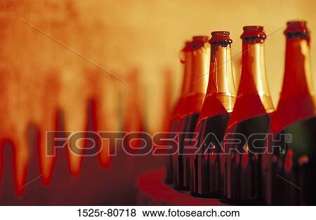 Close-up of champagne bottles in a factory View Large Photo Image Stock Photo - Close-up of champagne bottles in a factory. Fotosearch