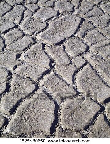 Close-up of cracks on dry mud View Large Photo Image Stock Image - Close-up of cracks on dry mud. Fotosearch