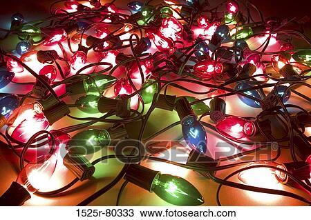 Close-up of lit up Christmas lights View Large Photo Image Stock Image - Close-up of lit up Christmas lights. Fotosearch