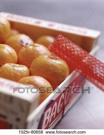 Close-up of oranges in a box View Large Photo Image Stock Photo - Close-up of oranges in a box. Fotosearch