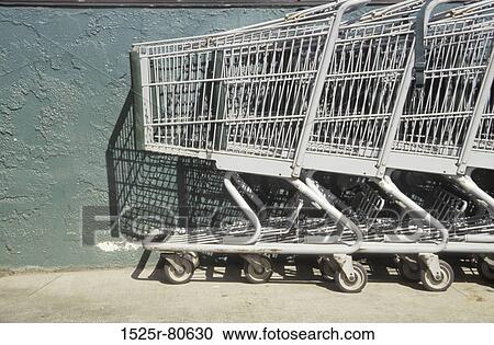 Close-up of shopping carts in a row View Large Photo Image Stock Image - Close-up of shopping carts in a row. Fotosearch