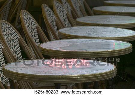 Close-up of tables and chairs in a row View Large Photo Image Stock Image - Close-up of tables and chairs in a row. Fotosearch