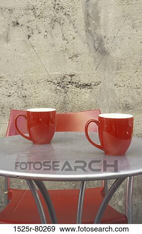 Close-up of two cups on a table View Large Photo Image Stock Photo - Close-up of two cups on a table. Fotosearch
