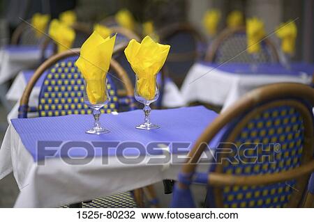 Close-up of two glasses with napkins on a table View Large Photo Image Stock Image - Close-up of two glasses with napkins on a table. Fotosearch