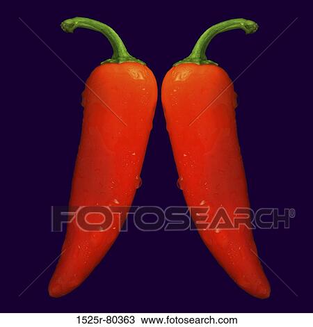 Stock Image - Close-up of two red chili peppers. Fotosearch
