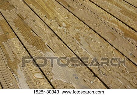 Close-up of water on wooden planks View Large Photo Image Stock Image - Close-up of water on wooden planks. Fotosearch