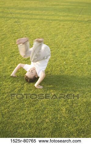 High angle view of a boy playing in a park View Large Photo Image Stock Photography - High angle view of a boy playing in a park. Fotosearch