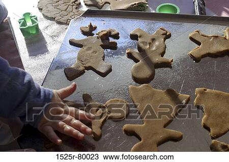 High angle view of a child's hand making cookies View Large Photo Image Stock Image - High angle view of a child's hand making cookies. Fotosearch