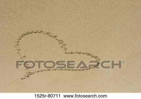 High angle view of a heart shape drawn on sand View Large Photo Image Stock Image - High angle view of a heart shape drawn on sand. Fotosearch