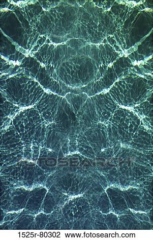 Stock Image - High angle view of ripples on the water surface. Fotosearch